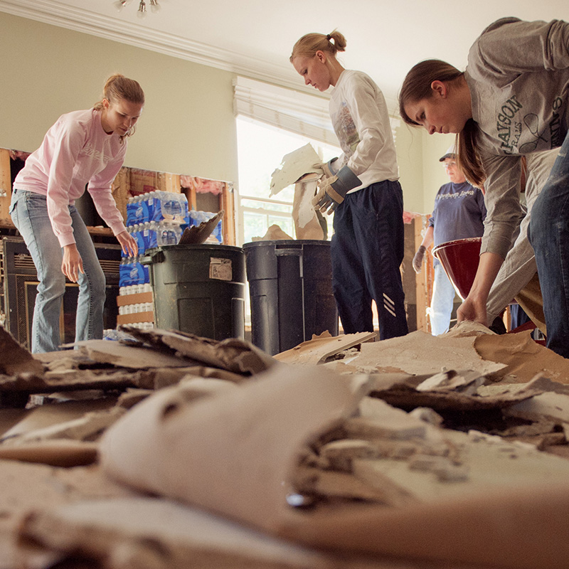 Adult students working on a service project