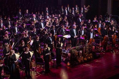 Symphony Orchestra performing on the Fisher Center stage