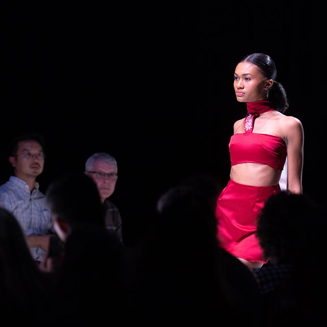 Model walks runway and annual student fashion show