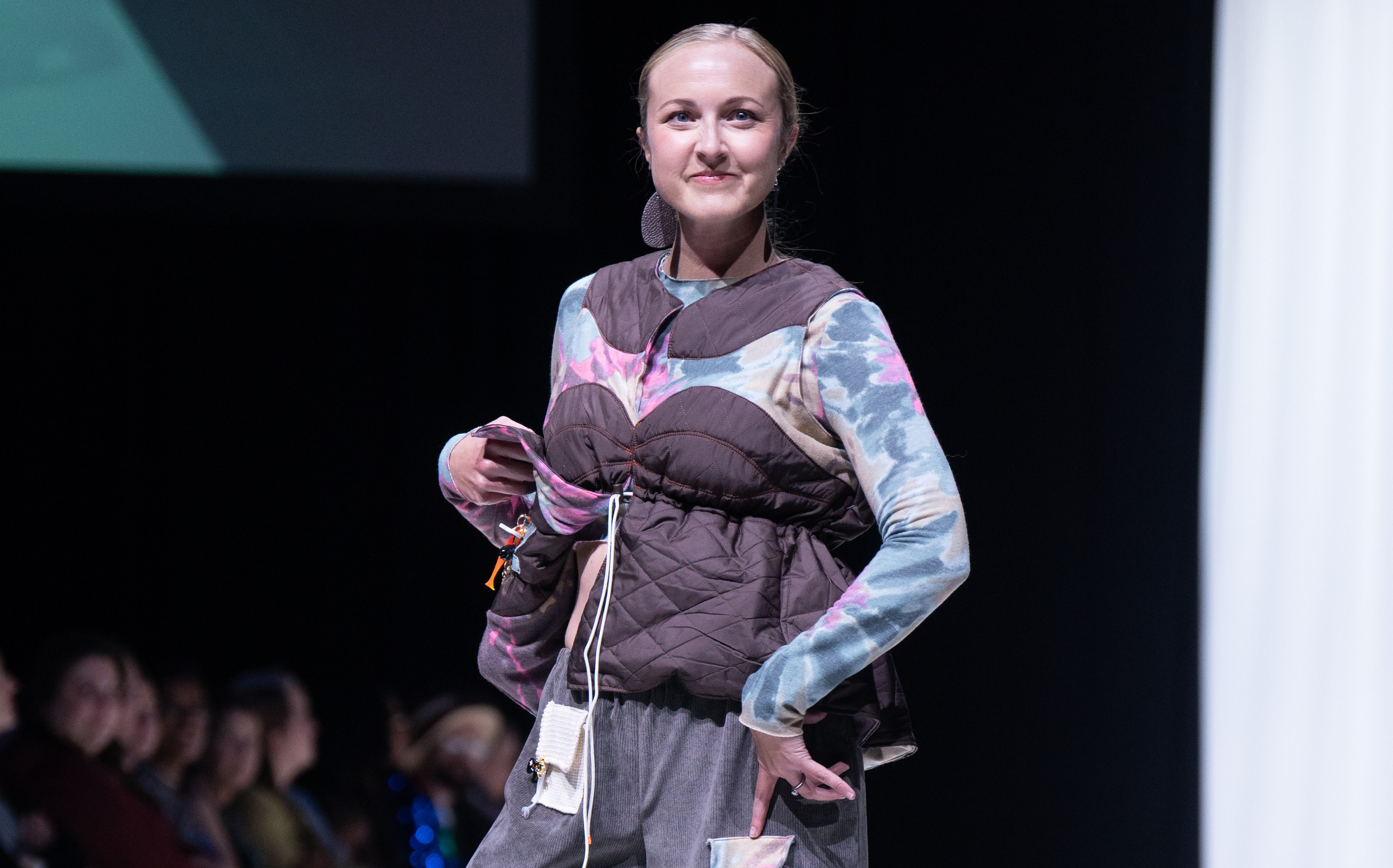 Brittany Cameron wears the designs from junior Macey Graham. honoring her late son's love of the outdoors, Japanese culture and automobiles.