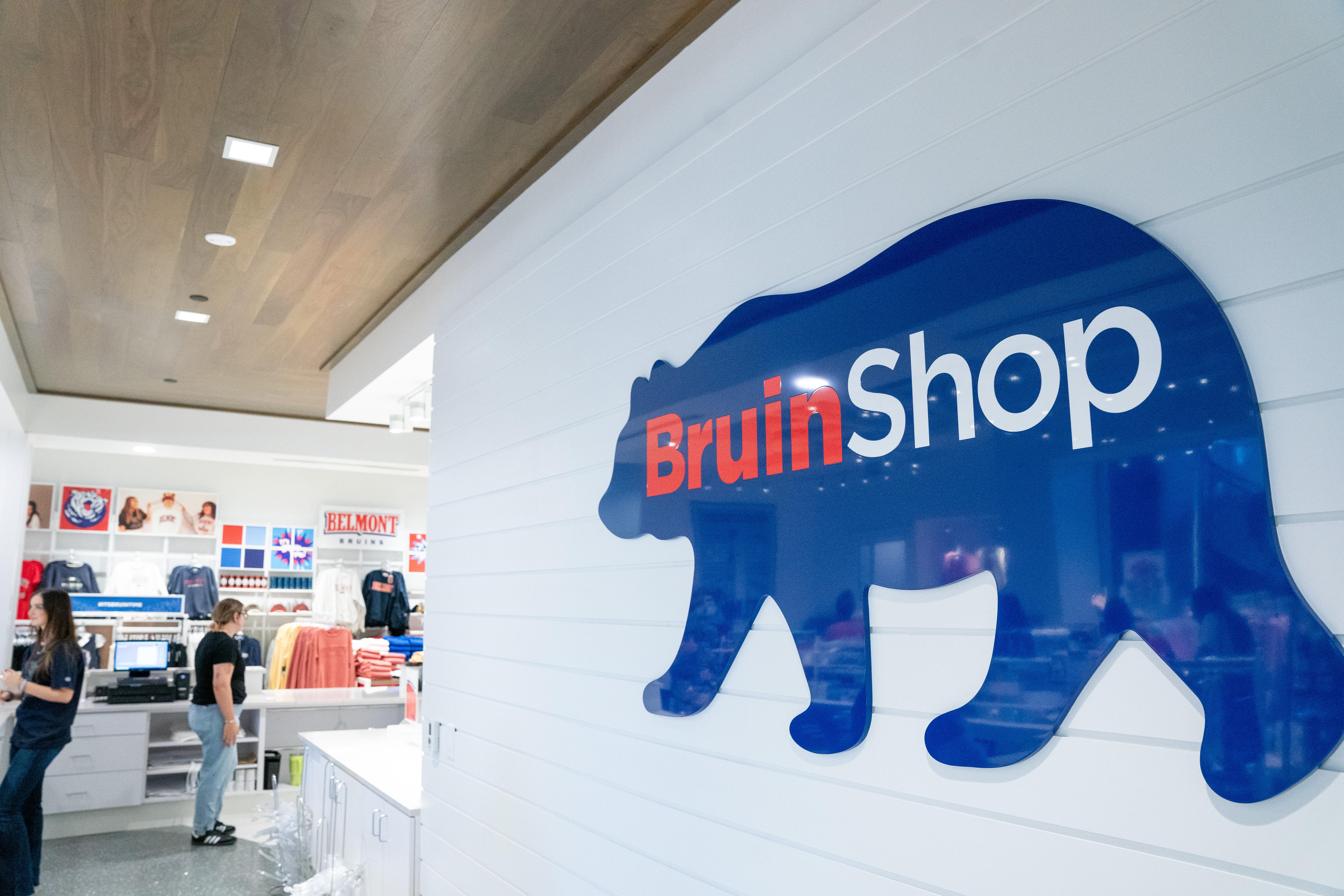 Image of The BruinShop logo on a wall, a large blue bear with the text on it