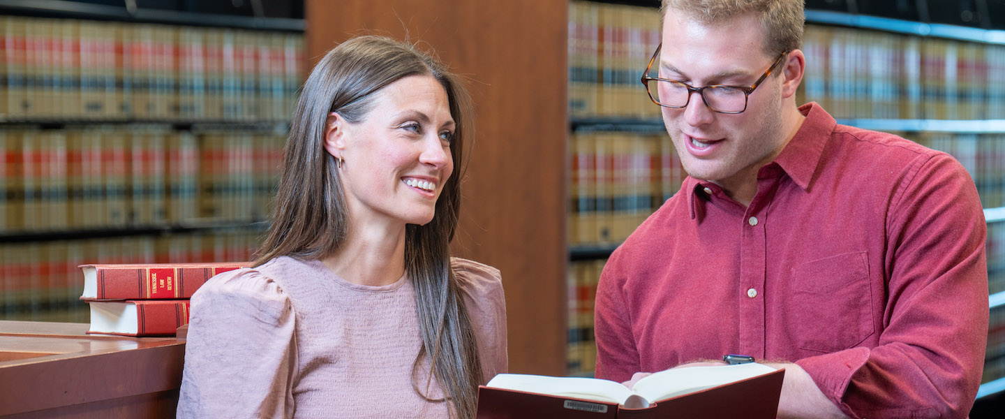 Two law students in law library