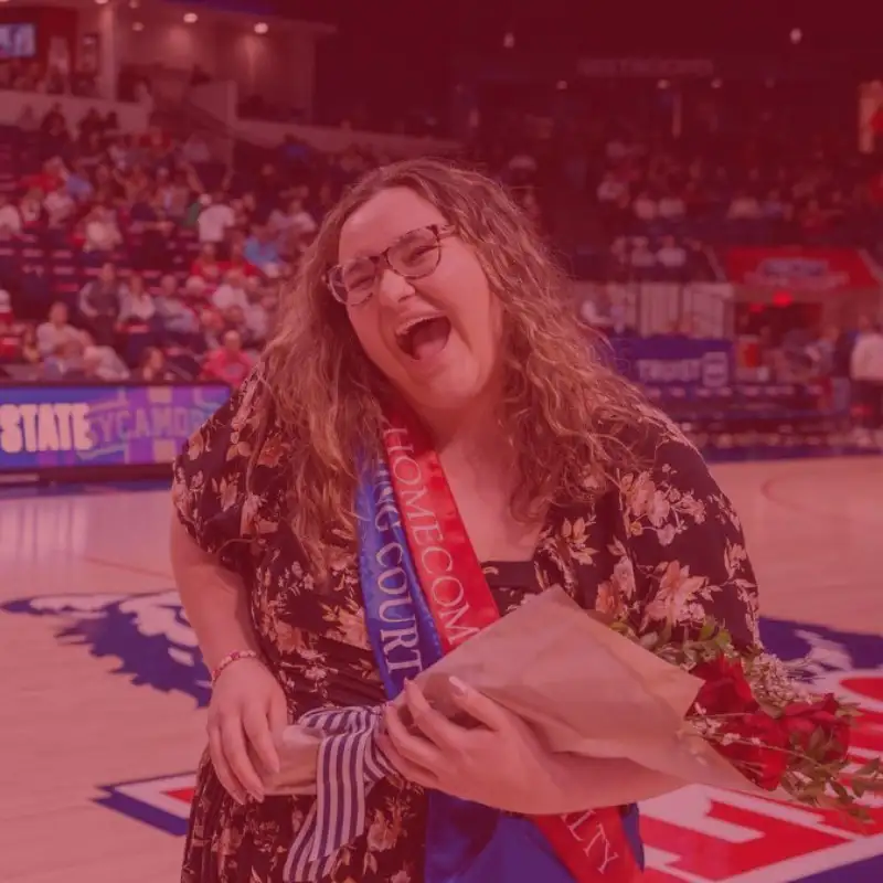 Cora Williams holding bouquet during Homecoming festivities