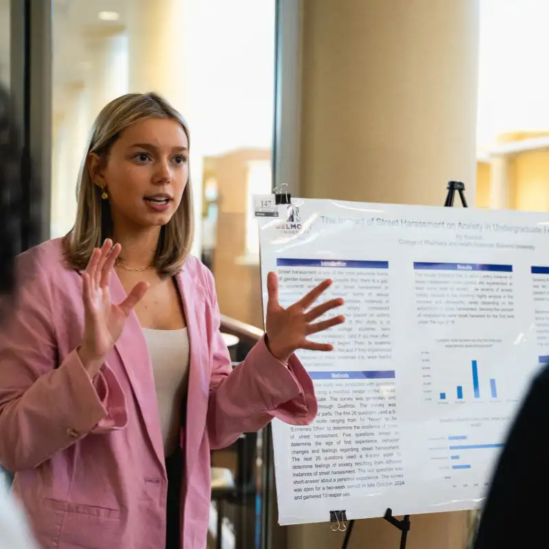 A female student presents at SPARK