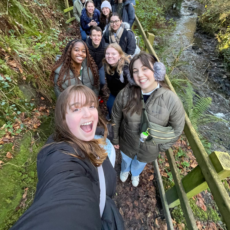 Students pose for selfie while on a hike while studying abroad.