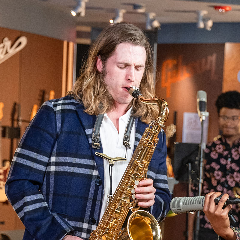 Cam Gallagher playing his saxophone on Belmont Tracks