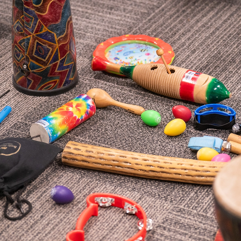 A few music therapy instruments on the floor.