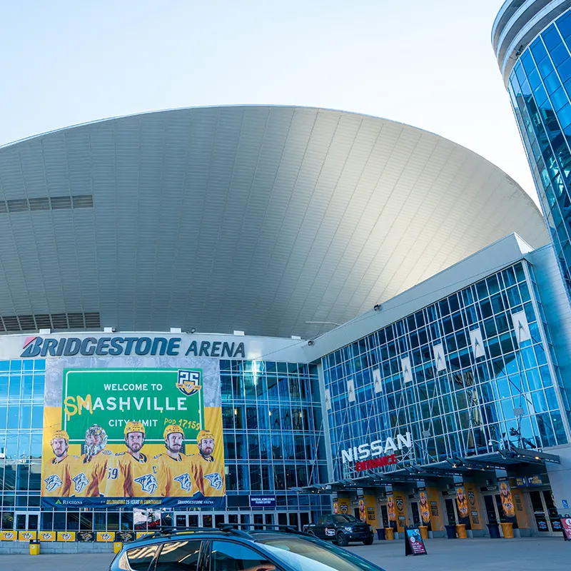 Bridgestone Arena in Nashville, Tennessee, featuring a large banner that reads 'Welcome to Smashville' with images of Nashville Predators hockey players in yellow jerseys.