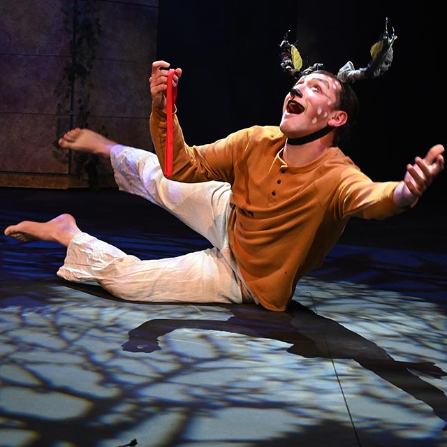 Theatre student dances on stage while dressed as a fawn
