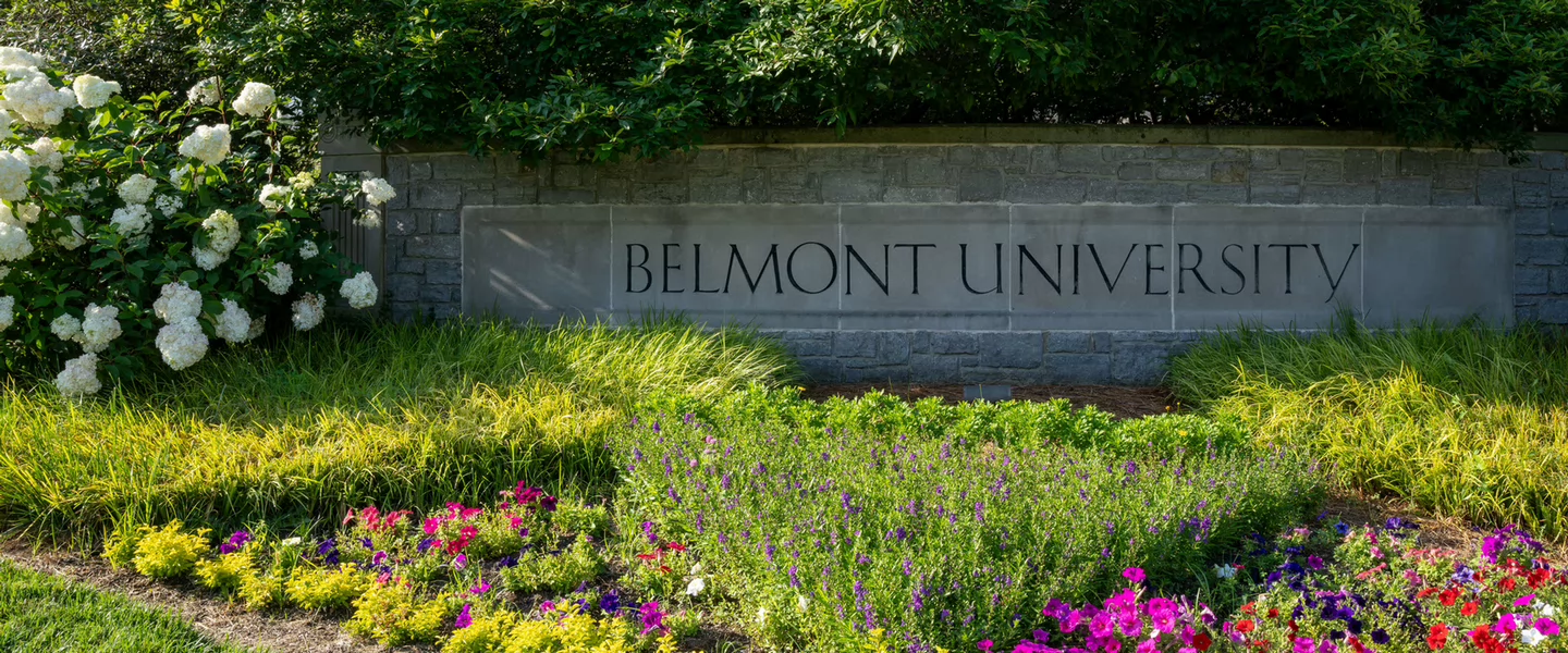 belmont university sign with blooming flowers in the foreground