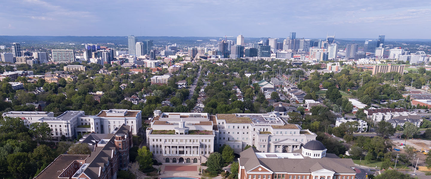 An aerial view of Belmont's campus with Nashville in the background