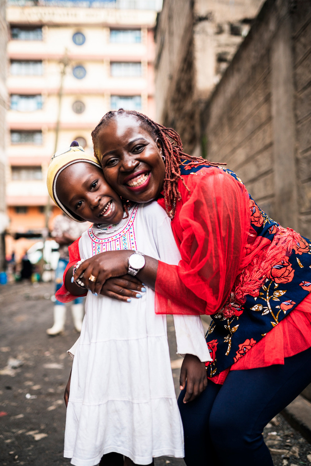 Maureen Owino and a child on a city street