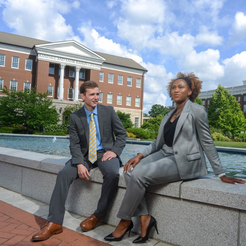 Students on Baskin stairs half turned towards camera