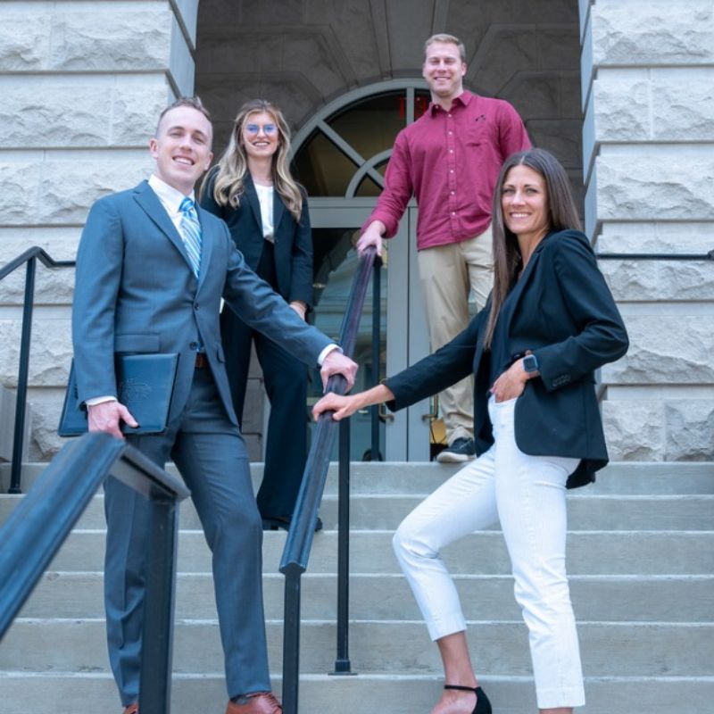 Students on Baskin stairs half turned towards camera