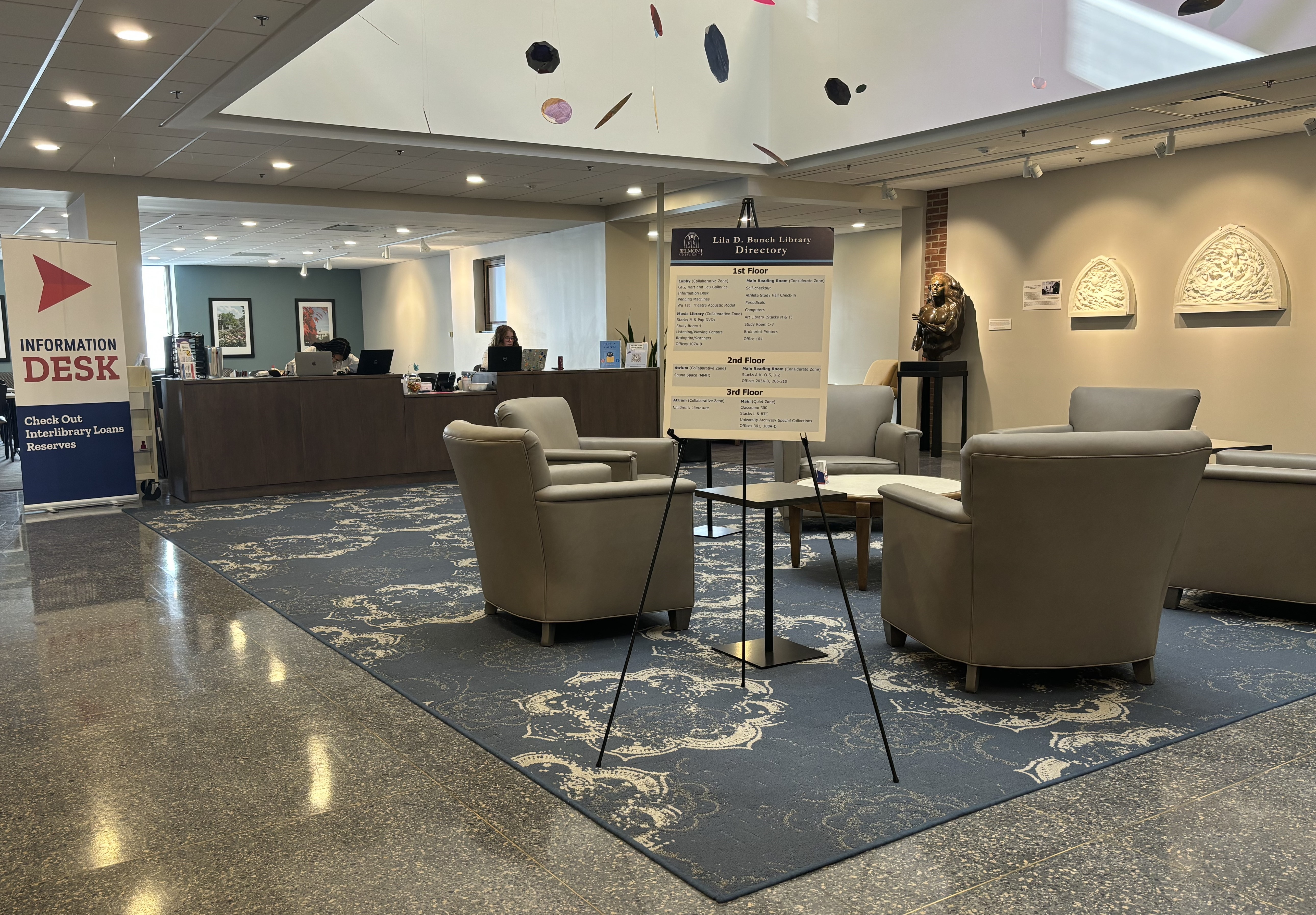 Tables and chairs in the lobby.