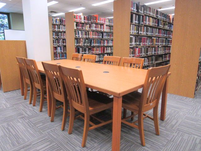 Tables and chairs in the second-floor main reading room considerate zone 