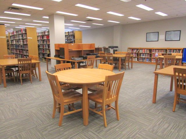 Tables and chairs in the music library's considerate zone 