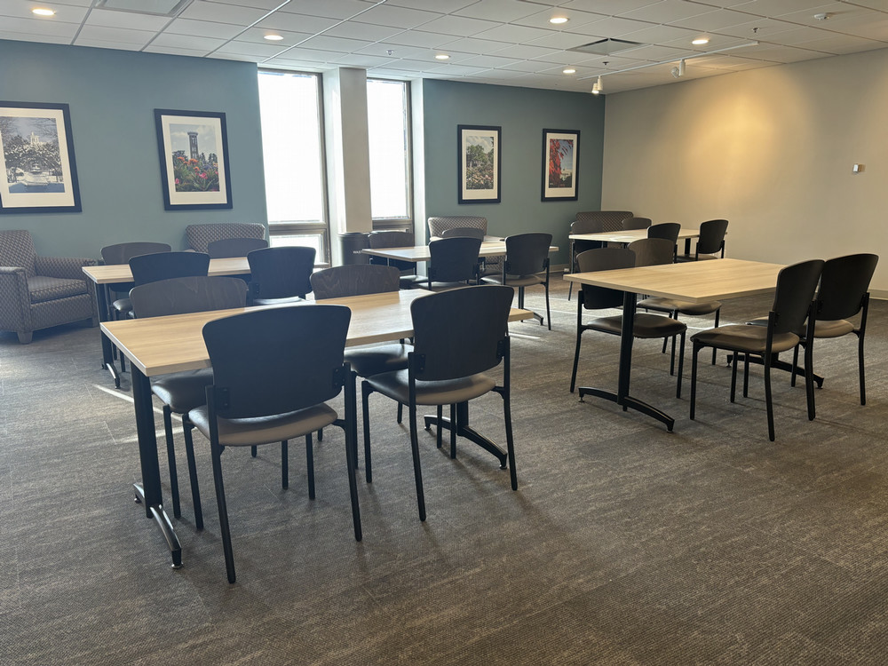 Tables and chairs in the Lila D. Bunch Library lobby.