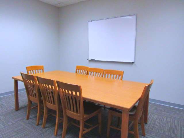 Tables and chairs in a Lila D. Bunch Library study room..