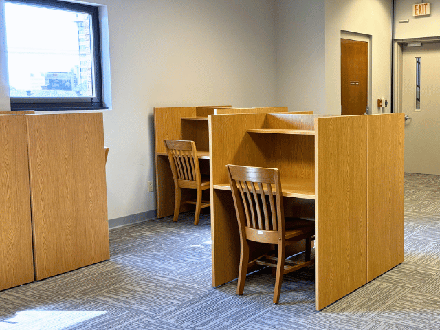 Tables and chairs in a Lila D. Bunch Library study room..