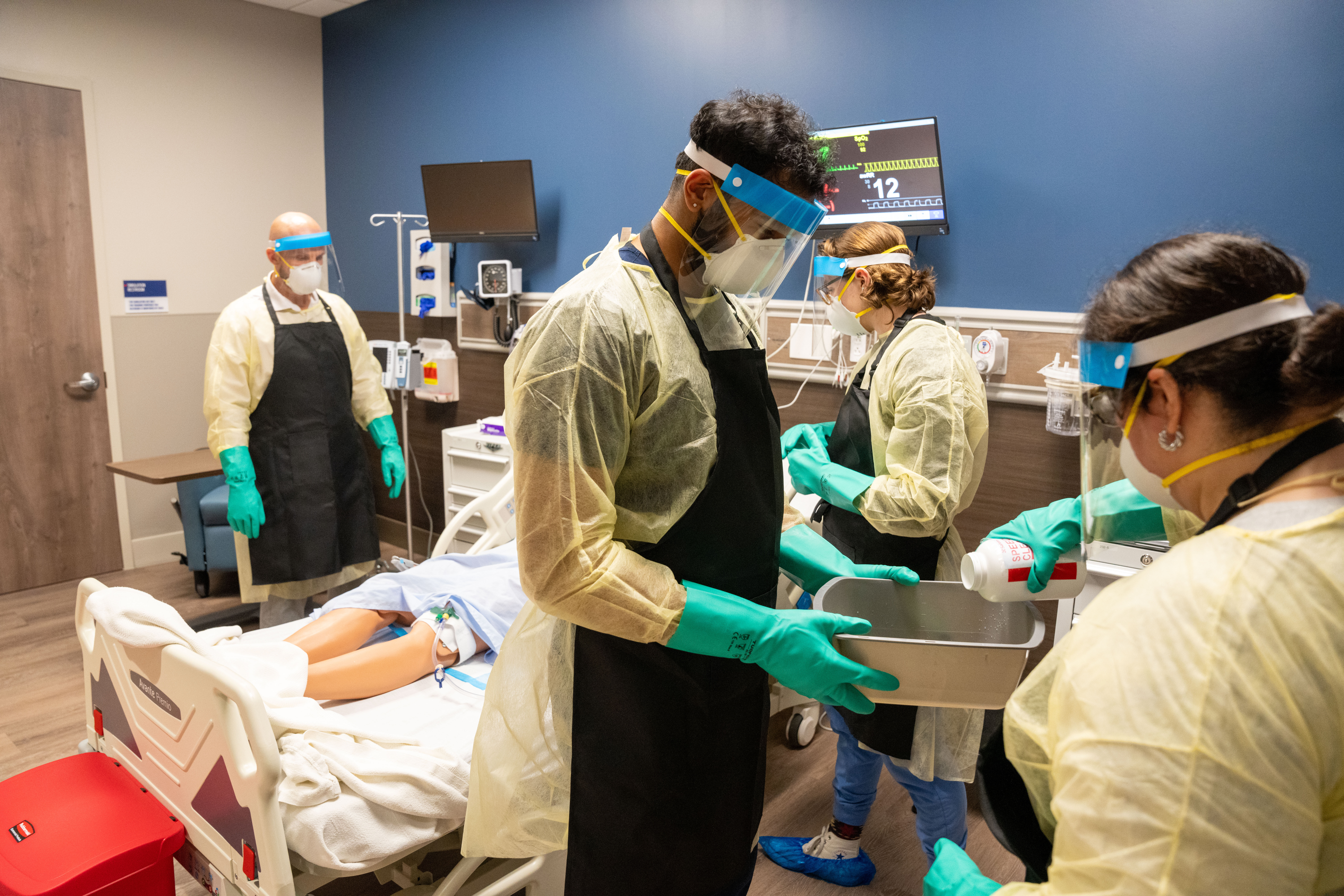MD and Health Science students work together on an end of life simulation