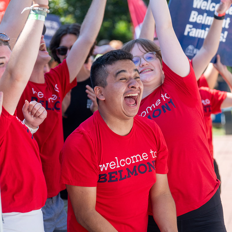 Orientation leaders cheering and smiling during move in