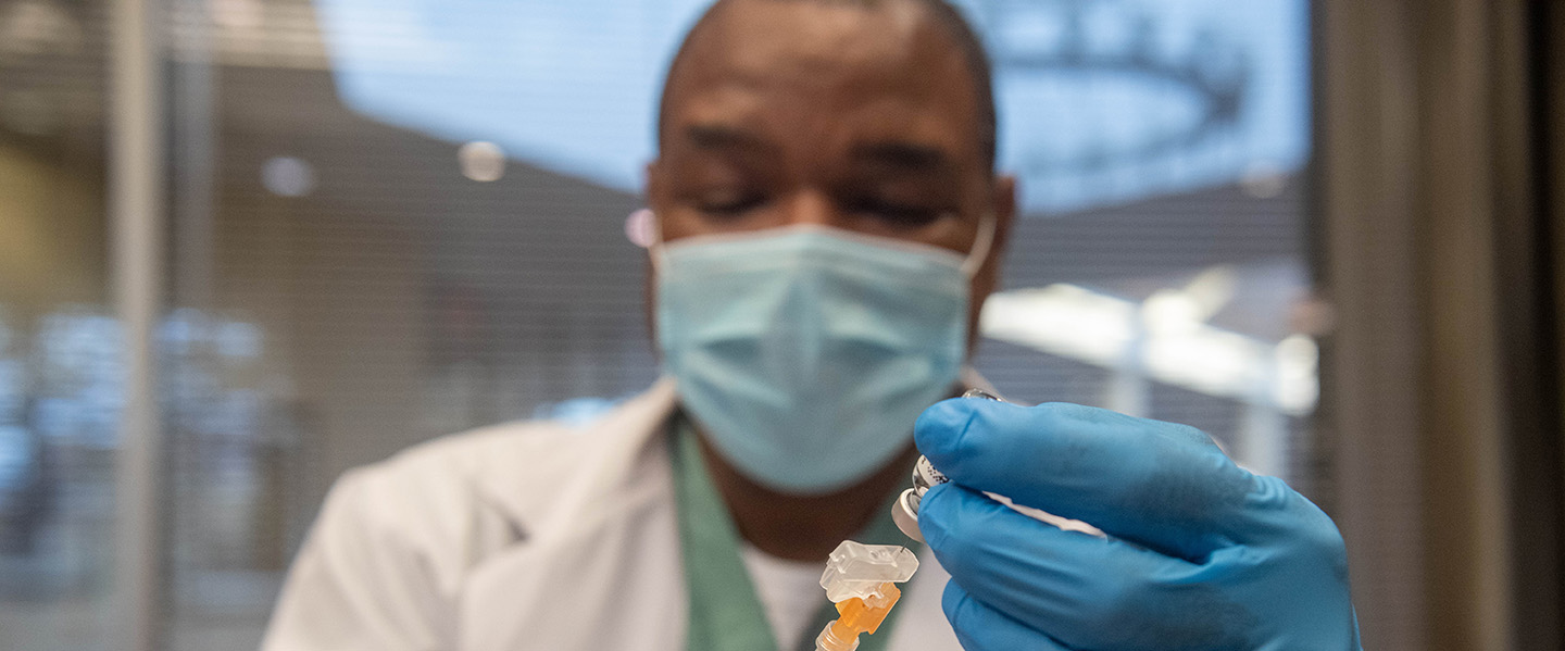 Student is preparing a syringe for use