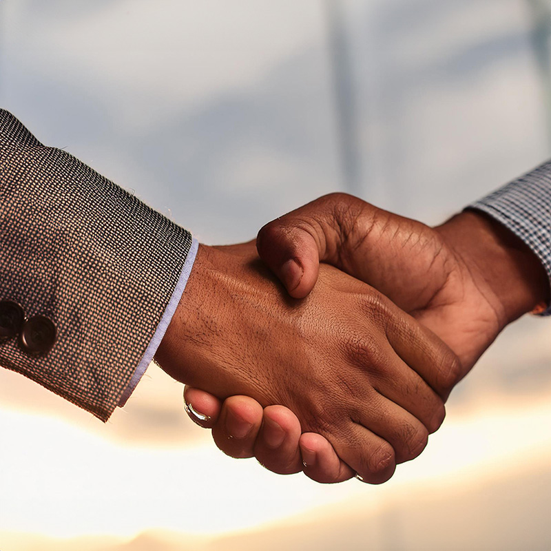 close up of 2 people shaking hands