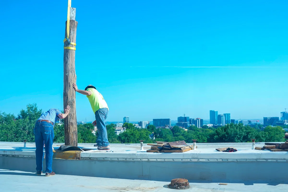 Removing chestnut supports from columns at Freeman Hall