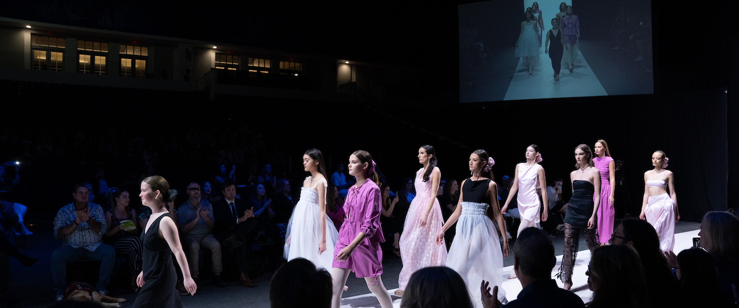 Senior student Anna Dimmerling's collection, models wearing pink and white garments resembling ballet attire