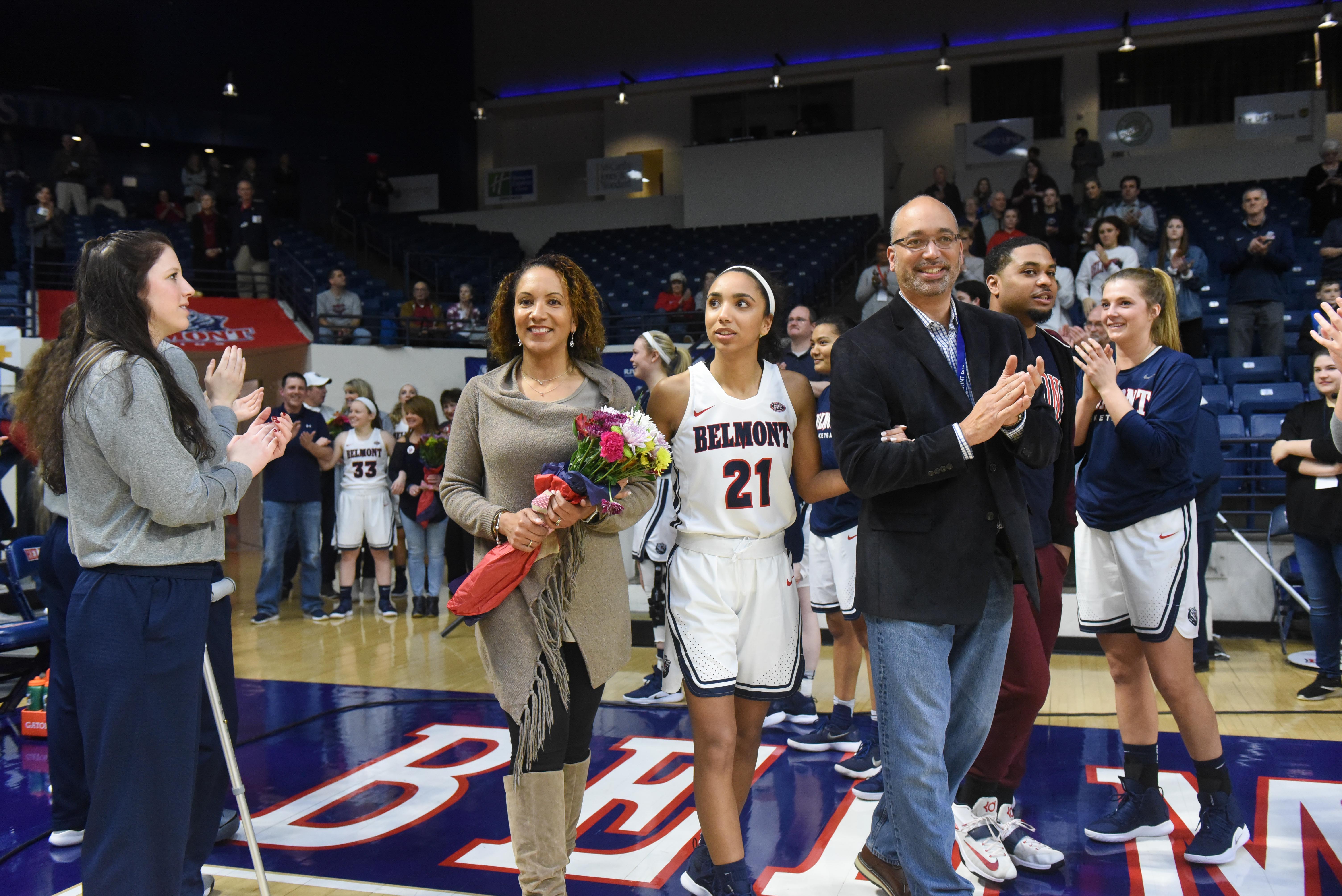 Lawson and her family walk out of the tunnel during Senior Night at Belmont