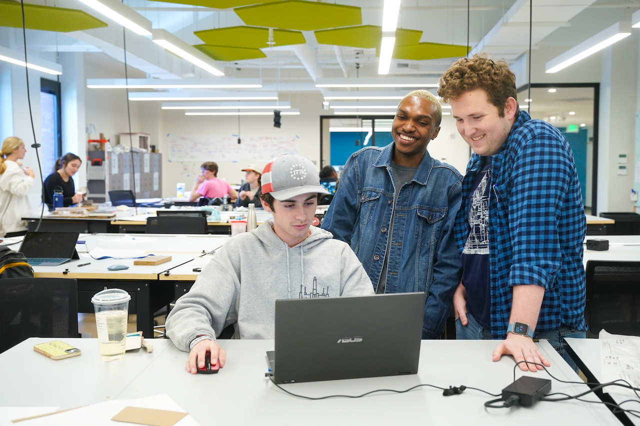 Three O'More students working on a project