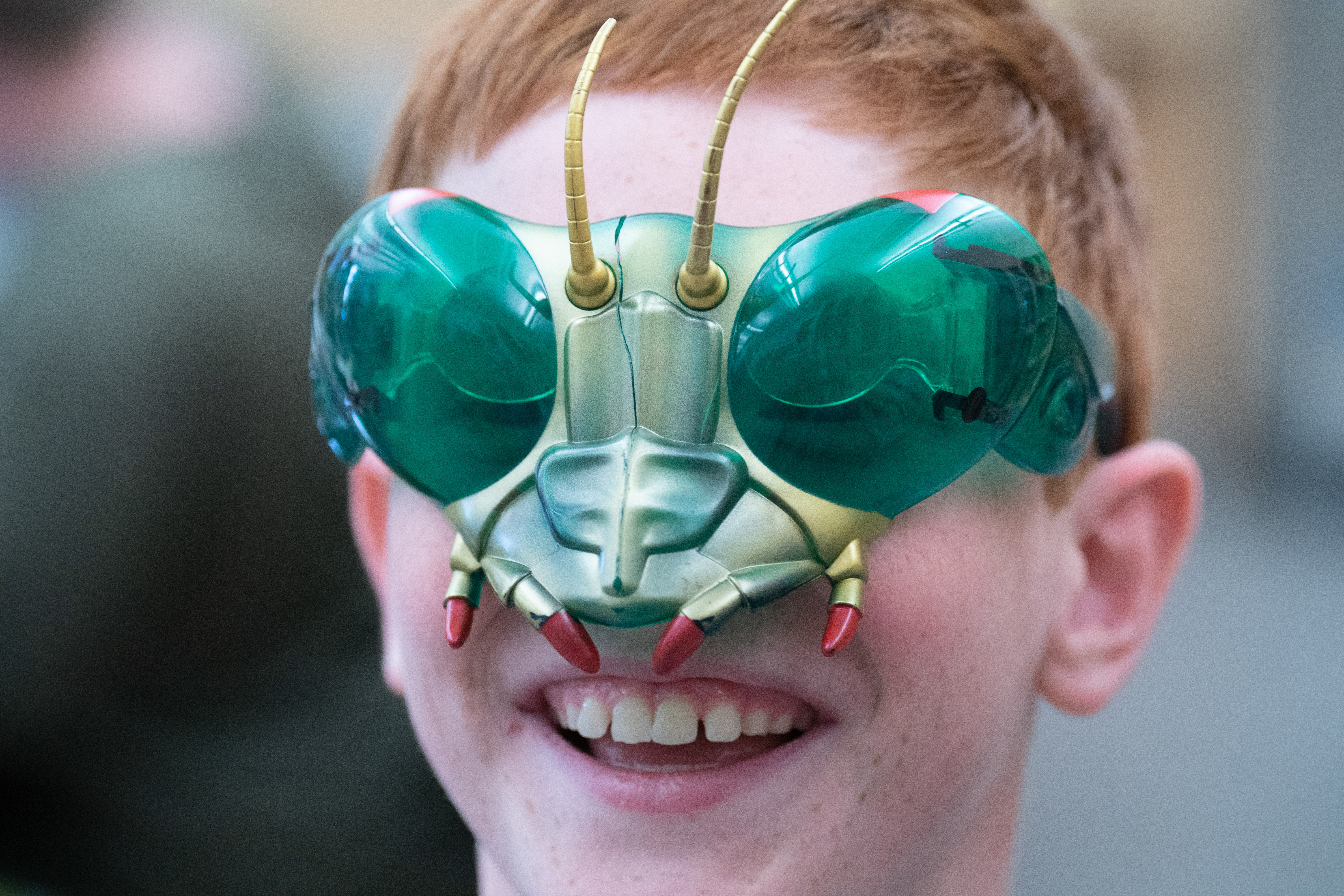 Camper wears bug mask