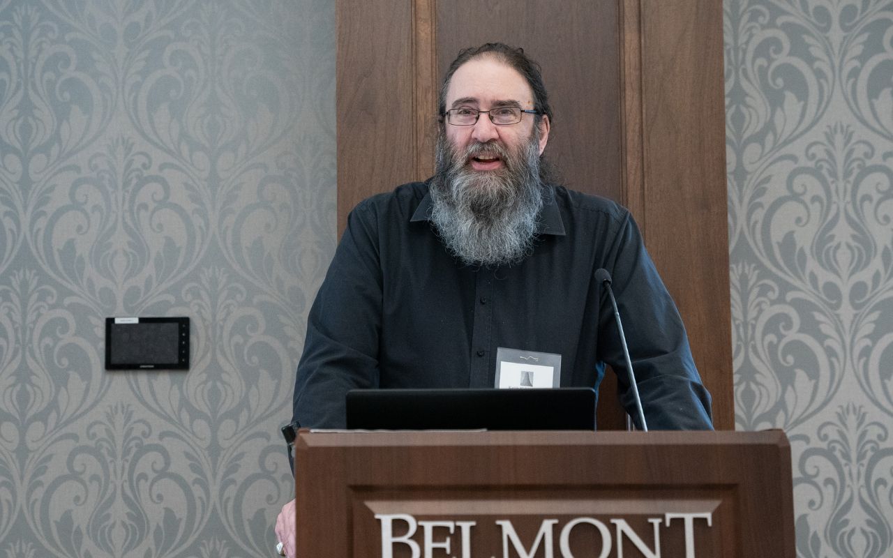 Keith Kahn-Harris speaking behind a podium