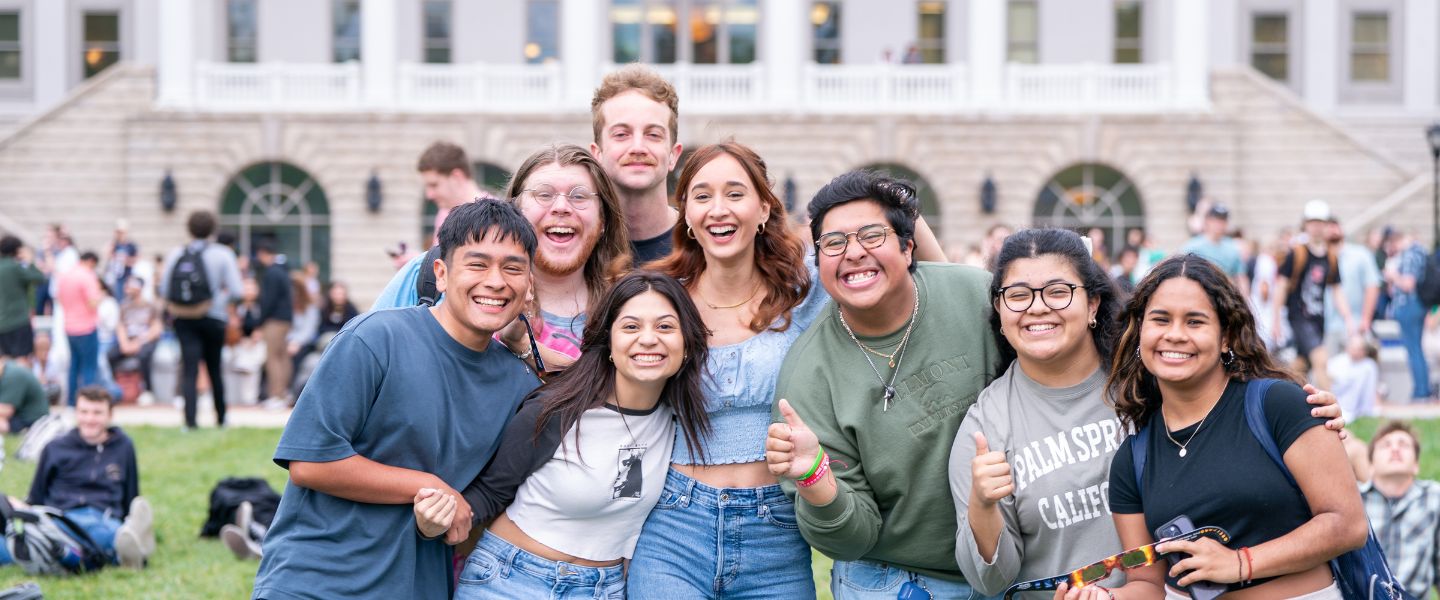 Group of students gathered and smiling at the camera