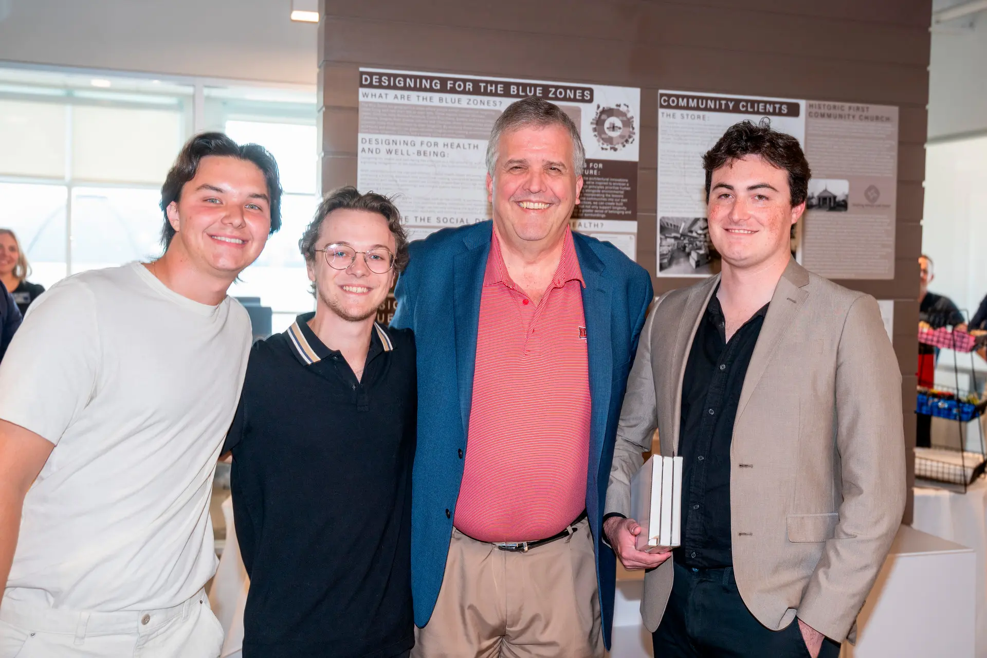 Design team pictured with University President Dr. Greg Jones