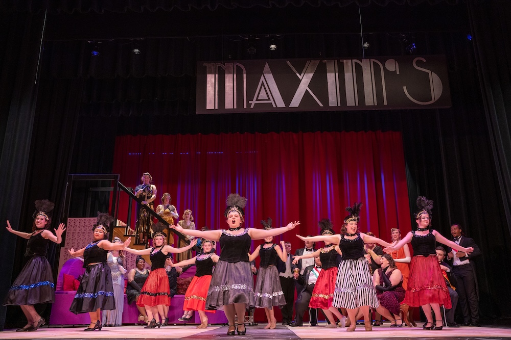 performers on stage for the merry widow