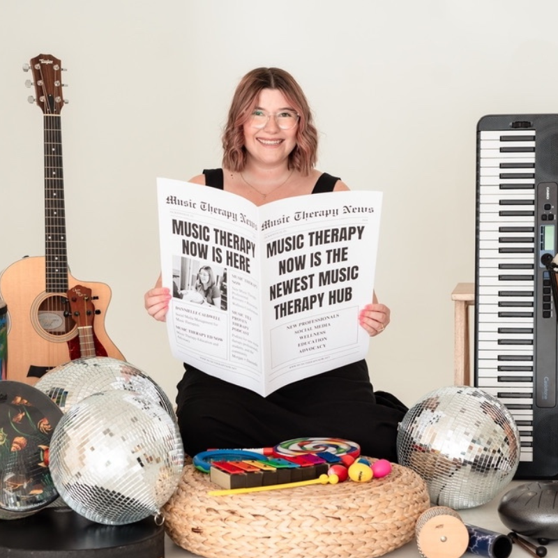 Dannielle Caldwell with newspaper