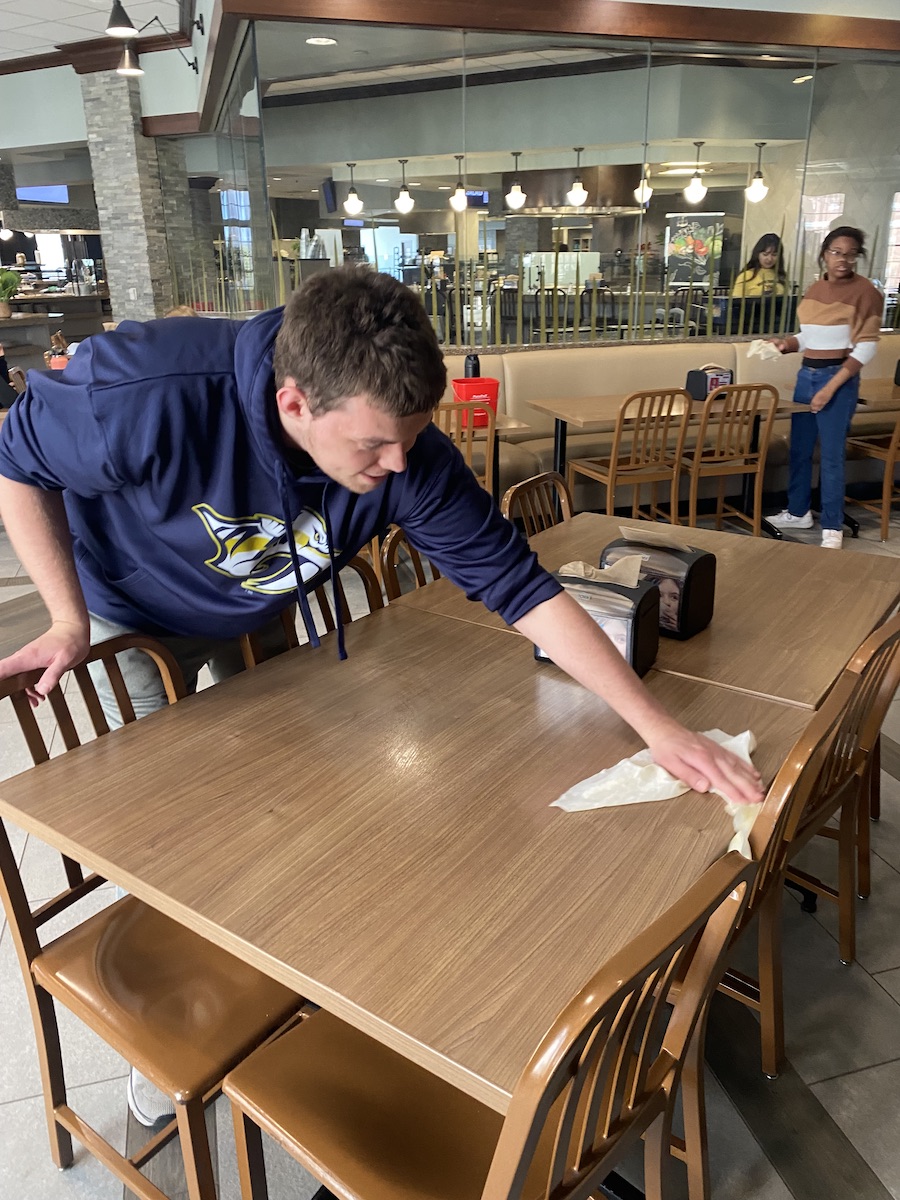 student working in dining hall