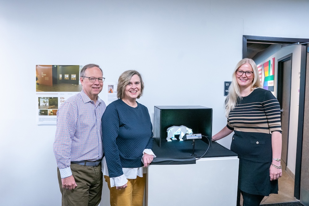 Novak with her parents at her project display