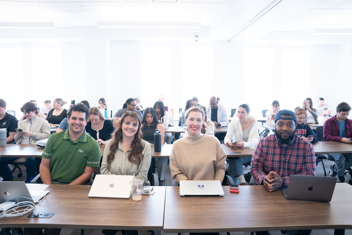 the four pitch competition judges smiling for the camera