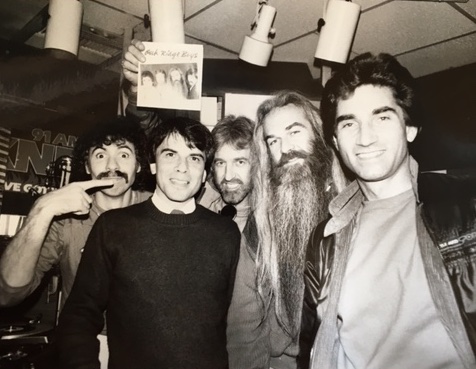 the early '80s: A young DJ poses with The Oak Ridge Boys at KNEW radio station in the San Francisco Bay Area