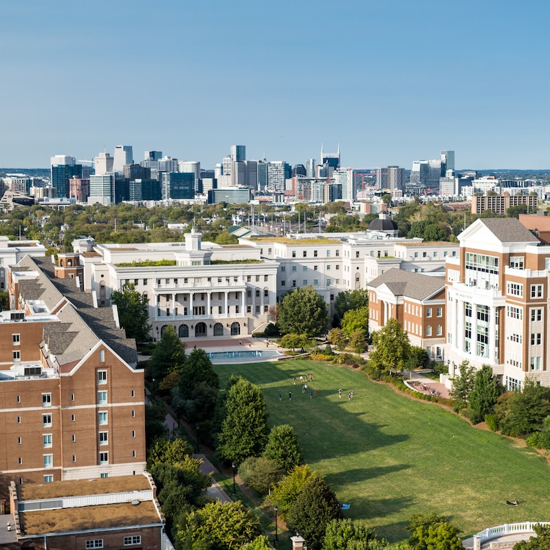 drone shot of Belmont's campus with Nashville in background