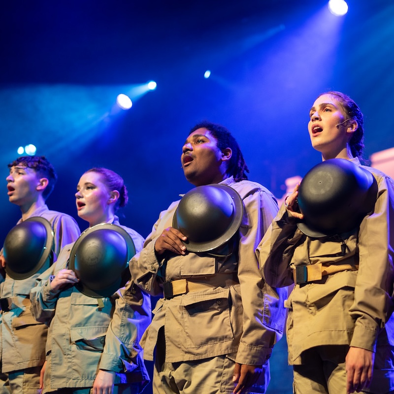 students sing in production of No Man's Land