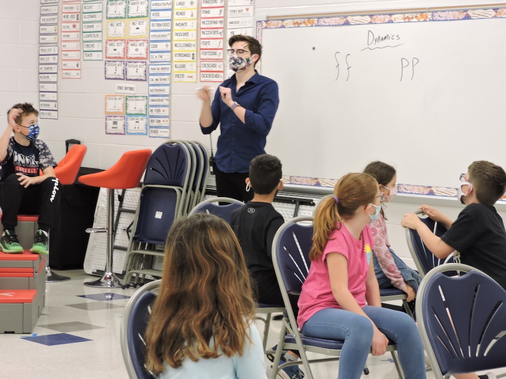 freddy teaching a classroom of younger students