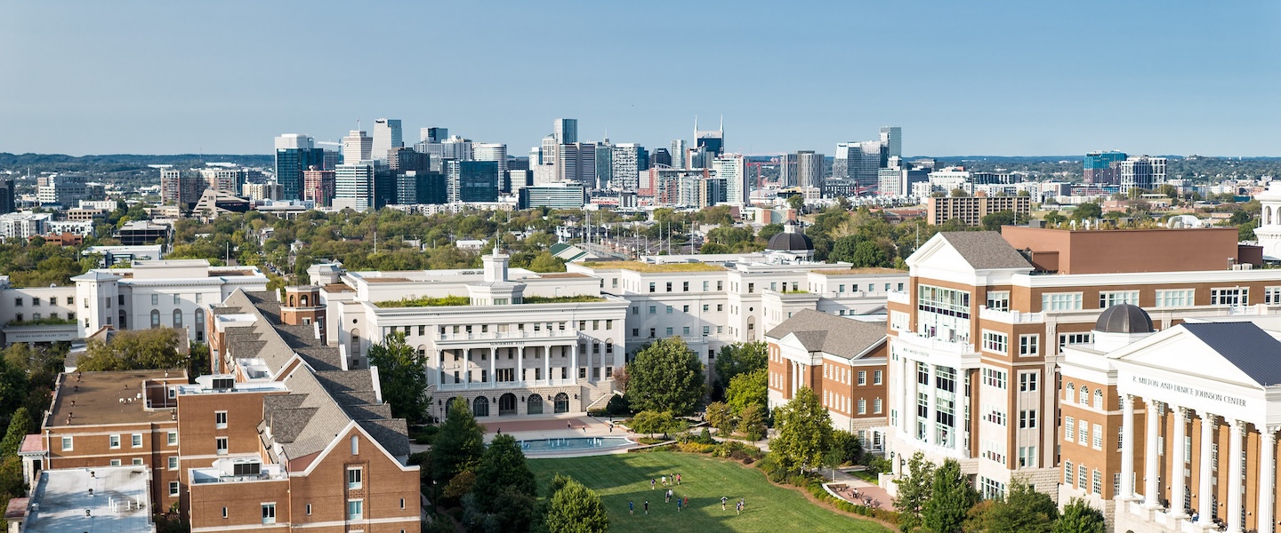 drone shot of Belmont's campus with Nashville in background