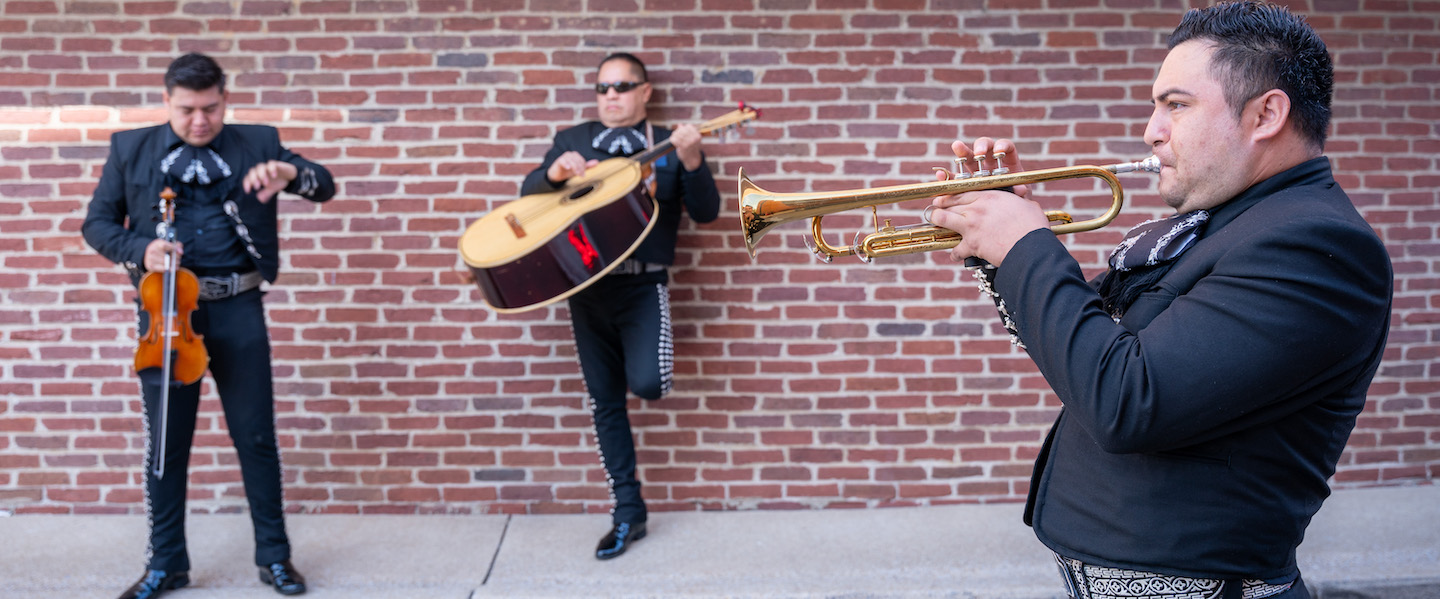 three mariachi musicians