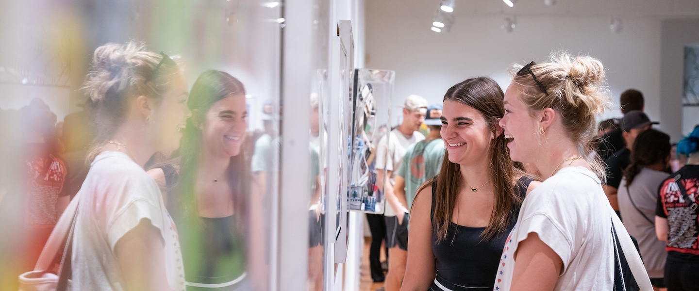 students admire Red Grooms's artwork in the gallery