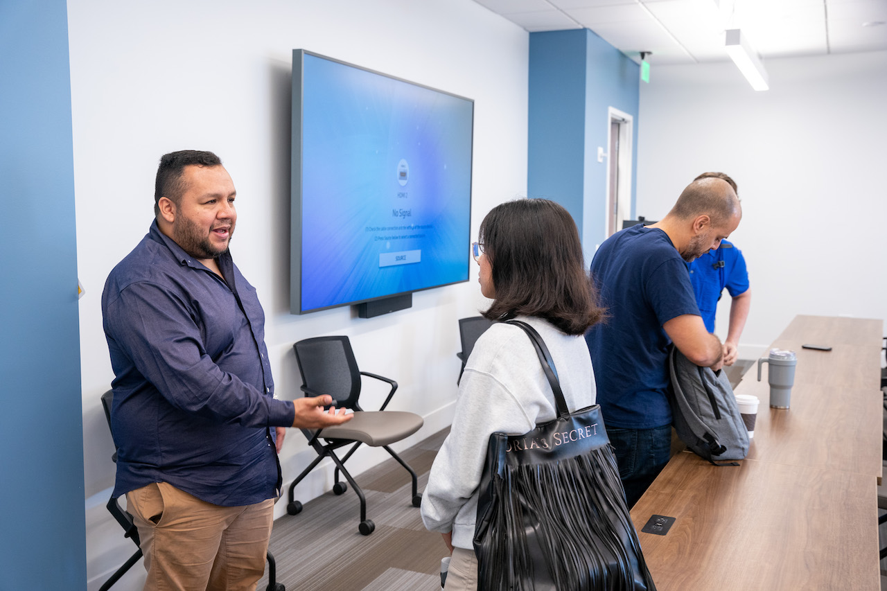 Camilo Patino speaks with student