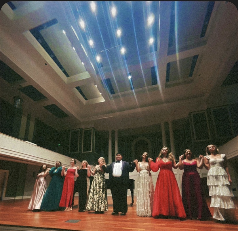 10 Belmont University students in costume bowing at the end of a production